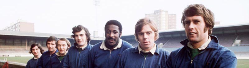 Sir Geoff Hurst and Harry Redknapp with the team at West Ham United